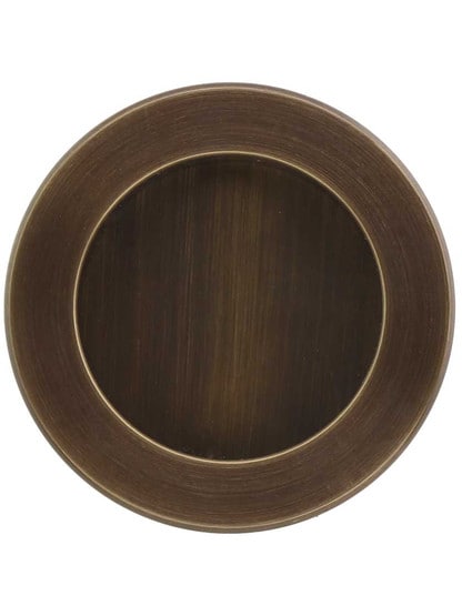 2 1/2 inch Round Flush Pull in Antique Brass.